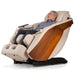 D.Core Stratus-JP Japanese Massage Chair in cream partially reclined with man relaxing.