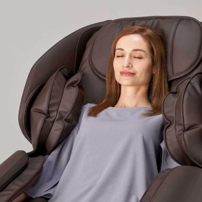 Synca Hisho Massage Chair with woman having a relaxing  time.