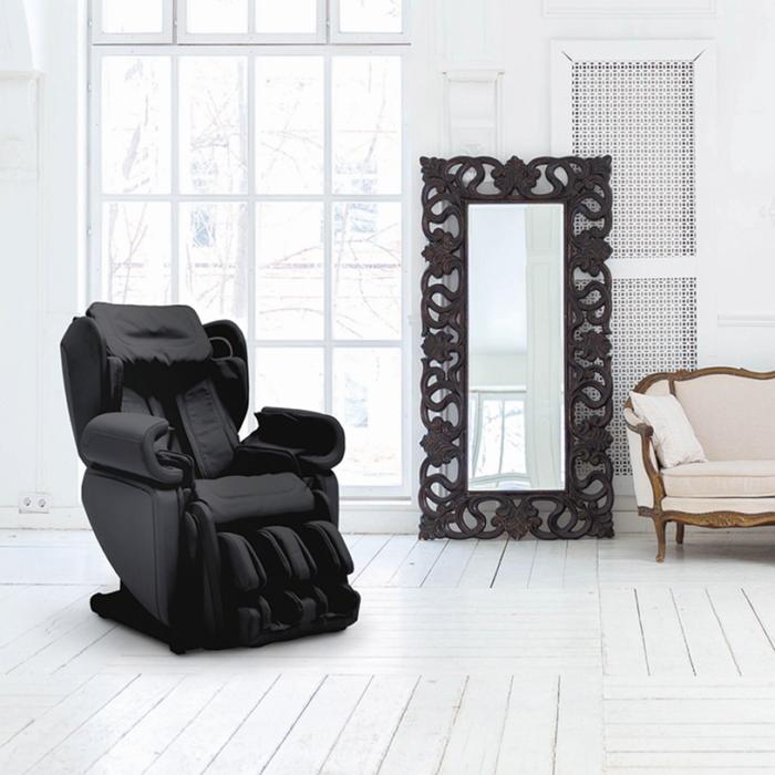 Synca Kagra J6900 Massage Chair in black inside a room.